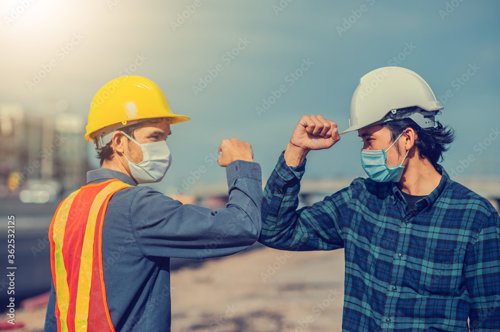 Asian man two people Engineer shake hand new normal on site construction